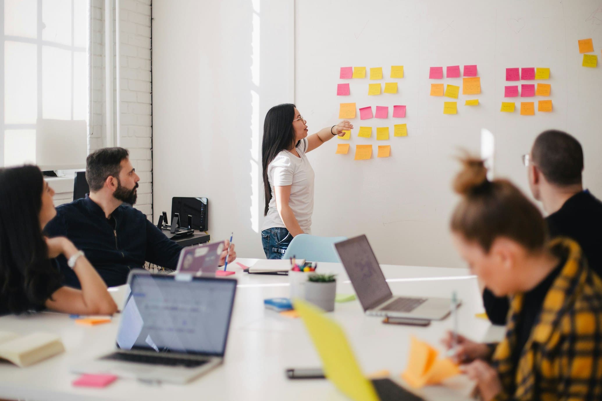 The Partners Plus Consultancy team collaborating on a client assignment in a modern office